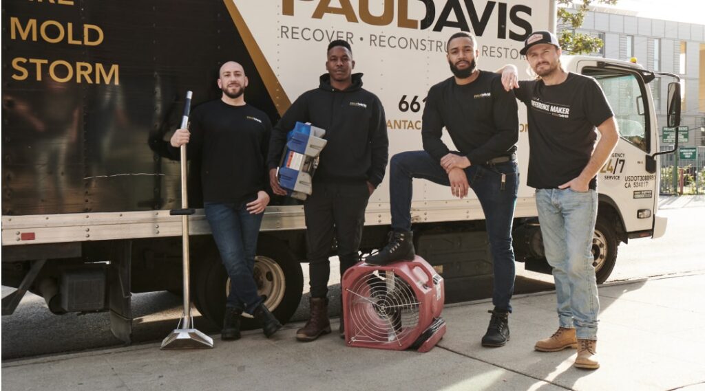 Paul Davis Restoration team in Boise, Idaho standing with service truck and water damage equipment, showcasing professional emergency restoration services and crew readiness